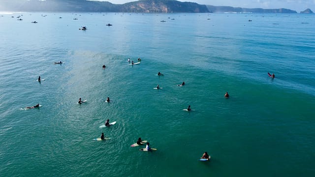 Drone photo of surfers waiting for a wave